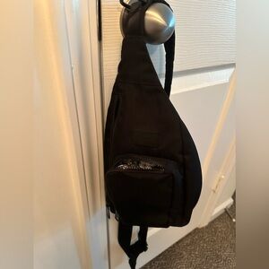 Vera Bradley black mini sling backpack.